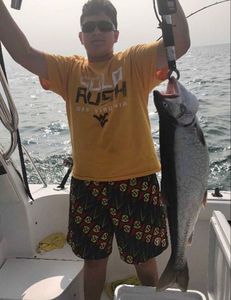 Angler holding a 28-inch fish at Port Monmouth Road