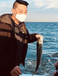 Angler with 14-inch fish on Port Monmouth Road