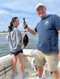 A single summer flounder fish measuring 13 inches in length caught by two people while fishing on Port Monmouth Road.