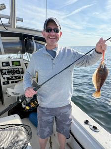 A person fishing for a California flounder on Port Monmouth Road