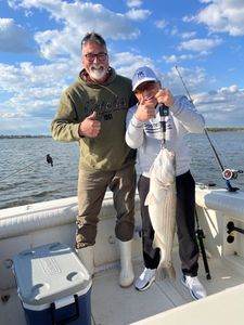 All smiles after reeling in this Striper! 