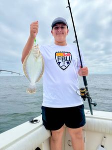 A person fishing with a rod in New Jersey