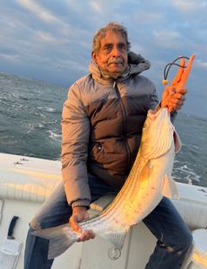 Angler catching a 21-inch fish in NJ