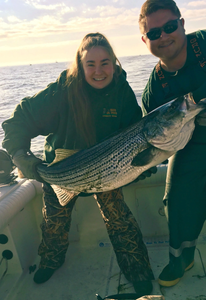 Striped bass fishing catch on boat in Port Monmouth Road NJ waters