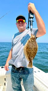 Image of a southern flounder, a 20-inch fish caught while fishing in NJ.