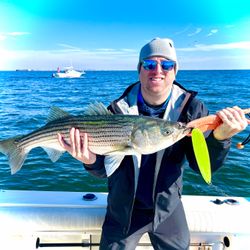 A Striped Bass measuring 21 inches caught fishing at Port Monmouth Road