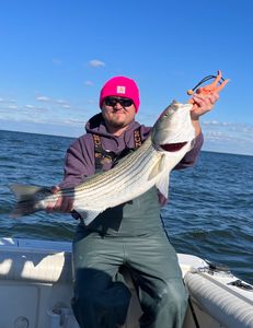 Angler with a striped bass catch in NJ