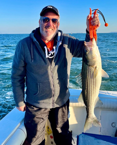 Striped bass caught fishing on boat in Port Monmouth Road NJ waters