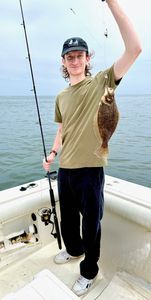 A summer flounder being caught on the Port Monmouth Road fishing location