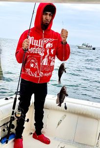 Two sea bass caught fishing in NJ