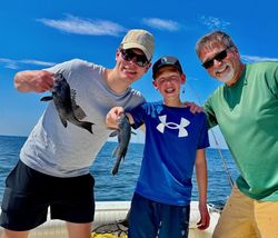 Two sea bass caught on a fishing trip at Port Monmouth Road