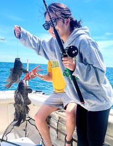 Two sea bass caught on a fishing trip at Port Monmouth Road