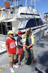 Three anglers with a catch of 2 large fishing in Puerto Plata