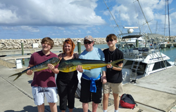 4 people fishing in Puerto Plata with 2 big fish