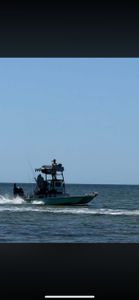 Fishing boat with tower cruising on ocean waters near Punta Gorda FL