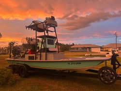 Fishing boat on trailer in Punta Gorda FL at sunset with dramatic orange sky