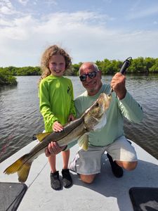 Successful snook fishing trip on boat in Punta Gorda FL waters with large catch displayed