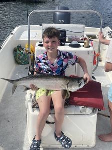 Tarpon caught while fishing in Punta Gorda FL displayed on boat deck
