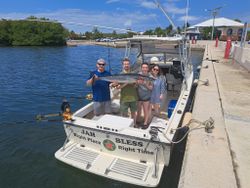 Smiling crew with an impressive Wahoo catch!