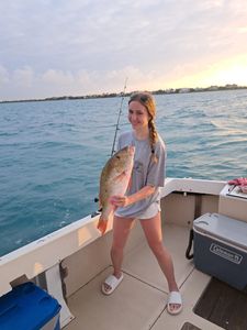 Happy angler with a vibrant Snapper!