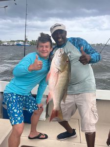 Excited team with a hefty Snapper!