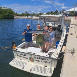 Proud crew with a hefty Wahoo!