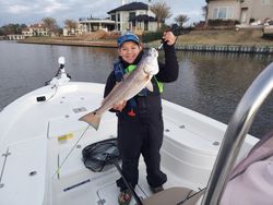 Angler holding a 19-inch redfish in Houston