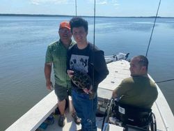 Three anglers fishing with rod and reel in South Carolina