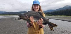 Fisherman holding a 30-inch fish in Alaska