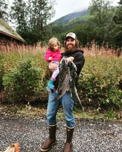 Fishermen in Alaska catching a 30-inch fish