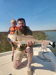 Redfish caught by two people fishing in SC