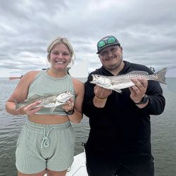 Two spotted weakfish caught by two people in Mount Pleasant