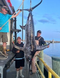 A happy group of anglers enjoying a great fishing trip in Hampton
