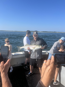 Big Striped Bass reeled in during an epic Deep Sea adventure!
