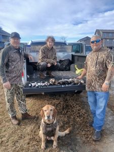 4 people fishing and hunting in Manteo