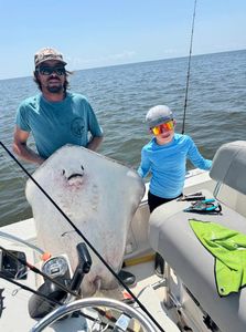 Two people enjoying a fishing and hunting adventure in Manteo