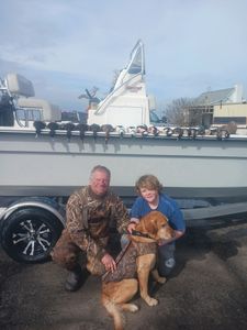 Two people enjoying a fishing and hunting adventure in NC