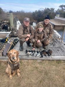 four people fishing in north carolina