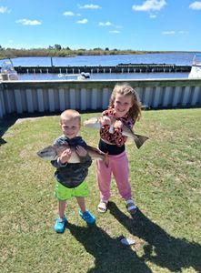Two people fishing in Manteo