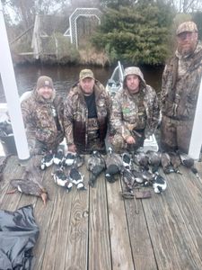 Four people fishing and hunting in North Carolina