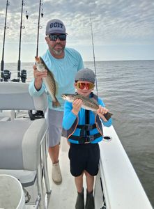 Two spotted weakfish caught while fishing in Manteo