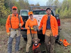 3 people enjoying a fishing and hunting trip in Maine
