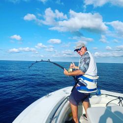 Person fishing in West Bay