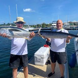 Two anglers reeling in big fish in West Bay