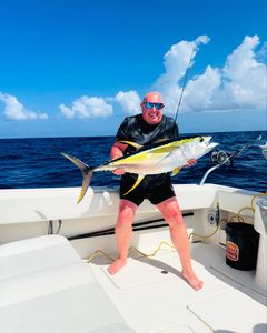Photograph of a 34-inch yellowfin tuna caught while fishing in West Bay