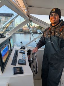 Angler enjoying a cruises and fishing excursion in Forked River