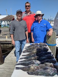 3 people enjoy a cruises and fishing trip in Forked River