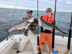 Two striped bass caught during cruises and fishing at Forked River