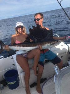 2 anglers fishing with 1 fish in Florida