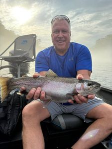 Fisherman with rainbow trout caught in Missouri